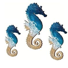 three seahorses are standing next to each other on a white background, one is blue and the other is brown