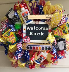 the welcome back wreath is decorated with candy and crayons