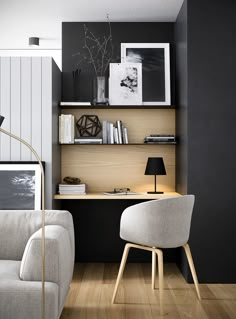 a living room filled with furniture next to a wall mounted bookshelf and a lamp