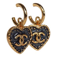 These Chanel CC denim heart earrings feature small gold tone metal CC hoops with a dangling gold and blue Denim enamel heart, with a gold tone CC in the center, and have post back earring closure. Origin: ItalyCondition: New and never wornAccompanied by: Box, felt jewelry cover, ribbon, carebook and retail UPC, Measurements: 1.5" (top of hoop to bottom of heart) x 1" (across heart) Vintage Chanel Jewelry, Brand Earrings, Denim Earrings, Fashion Moodboard, Dangle Earrings Gold, Felt Jewelry, Luxury Earrings, Gold And Blue, Heart Dangle Earrings