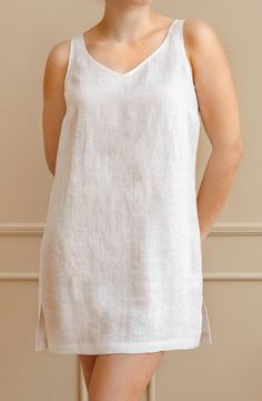 Elevate your summer wardrobe with our exquisite knee-length linen tunic. Crafted from lightweight and breathable linen fabric, this tunic offers the perfect combination of comfort and style. Whether you're strolling on the beach, exploring the city, or enjoying a casual outing, this versatile linen top is a must-have addition to your collection. Embrace the natural elegance of linen and indulge in the ultimate summer fashion.  ~ Includes 1 tunic; ~ OEKO-TEX Standard 100 certified fabric. * Pleas Linen V-neck Tunic For Summer, Summer Linen Tunic, Sleeveless Tunic For Spring Vacation, Sleeveless Spring Vacation Tunic, Sleeveless Unlined Linen Day Dress, Spring Vacation Sleeveless Tunic, Unlined Sleeveless Linen Daywear Dress, Unlined Sleeveless Linen Dress, Summer Linen Sleep Dress