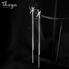 Experience the unique design of Thaya's Silver Cross-shaped Earrings for Women. Made from high-quality 925 silver metal material and designed with a stunning cross pattern, these earrings are both elegant and sophisticated. With a focus on female gender and an overall length of about 12cm and cross size of 10*17mm, they are perfect for any occasion. Elevate your style with Thaya's stunning Silver Cross-shaped Earrings. Elegant Pierced Cross Earrings, Silver Sterling Cross Earrings, Silver Sterling Silver Cross Earrings, Minimalist Silver Cross Earrings, Silver Tassel Earrings, Cross Patterns, Silver Cross, Metal Material, Tassel Earrings