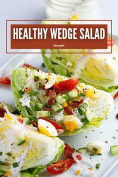 healthy wedge salad with lettuce and tomatoes on a white plate next to a glass of water