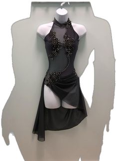 a mannequin wearing a black dress with silver beads