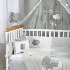 a baby crib bedding set with an elephant theme