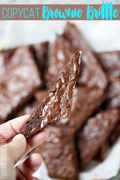 chocolate brownie bites are being held up in front of the camera with text overlay