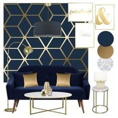 a living room with blue couches, gold accents and white tables in front of a wall