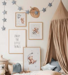 a child's bedroom with pictures on the wall