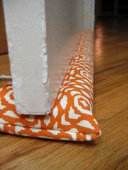 an orange and white cloth on the floor