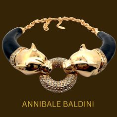 Expertly handcrafted in Italy by skilled artisans, the Annibale Baldini Panther Statement Necklace exudes power and elegance. Featuring a stunning panther design with a ring of Swarovski crystal, this statement piece will elevate any outfit with its intricate craftsmanship and luxurious materials. Channel your inner strength and confidence with this exquisite necklace. This item is new. Material : 24K yellow gold plated brass, enamel, Swarovski crystalMade in Italy🇮🇹 Panther Necklace, Panther Design, Crystal Statement Necklace, Art Deco Bracelet, Bridesmaid Gifts Jewelry, Retro Ring, Monogram Gifts, Vintage Engagement, Art Deco Jewelry