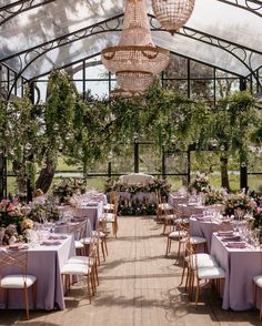 the inside of a greenhouse with tables and chairs set up for an outdoor wedding reception