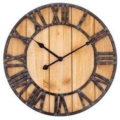 a large wooden clock with roman numerals and the words wellington on it's face