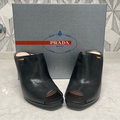 Brand New, Never Worn Prada Black Leather Clog Gold Hardware Original Box And Dust Bag Included Heel Height : 4.25” Elegant Black Clogs With Reinforced Heel, Formal Black Clogs With Padded Heel, Formal Leather Clogs With Open Heel, Black Formal Clogs With Padded Heel, Open Toe Clogs With Reinforced Heel For Formal Occasions, Chic Formal Clogs With Reinforced Heel, Formal Open Toe Clogs With Reinforced Heel, Black High Heel Clogs For Formal Occasions, Formal Leather Open Heel Clogs