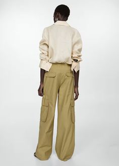 Trousers - Women | Mango USA Casual Linen Pants With Multiple Pockets, Beige Linen Cargo Bottoms, Khaki Cargo Jeans With Flap Pockets, Khaki Pants With Flap Pockets For Workwear, Khaki Workwear Pants With Flap Pockets, Khaki Linen Cargo Pants With Pockets, Linen Cargo Pants For Work, Straight Linen Cargo Pants With Pockets, Straight Leg Linen Cargo Pants