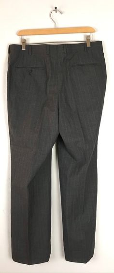 "-Description- >men's dark gray dress pants with white & red pinstripes >clip and zipper front >belt loops >open pockets in the front >one open and one button close pocket in the back >size 34 waist >great for a dressy event! >condition: very good >color(s): gray, red, white >fabric(s): woo. >brand: none >care: dry clean -Measurements- >size: 34 waist ✩ all measurements are taken with the item laying flat & some sizes are estimates so please check m Business Striped Pants With Belt Loops, Business Straight Leg Striped Dress Pants, Fitted Pinstripe Dress Pants For Business, Fitted Striped Pants With Belt Loops, Pinstripe Office Bottoms With Belt Loops, Striped Fitted Dress Pants For Business Casual, Fitted Striped Dress Pants For Business Casual, Fitted Striped Bottoms With Belt Loops, Classic Striped Dress Pants For Office