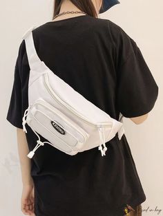 a woman is wearing a white fanny bag