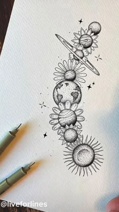 a drawing of the sun and planets on paper