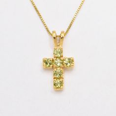 Peridot Cross Necklace set with a Created Peridot in a diamond cut and vibrant green color, at size 3mm (1.0 Ct combined).  Gold Vermeil: 18k Gold over Solid 925 Sterling Silver ☞ made to last.   Matching Ring: please ask me Matching Earrings: please ask me   Details :  ♥ Each item comes in a cute GIFT BOX ✓  ♥ GUARANTEE on the materials ✓ ♥ Created Peridot in a vibrant green color ✓ ♥ 18k Gold over Solid 925 Sterling Silver ☞ made to last. ♥ Measurements: Peridot at size 3mm (1.0 Ct combined) ✓ Yellow Peridot Jewelry For May Birthstone, Yellow May Birthstone Jewelry, Gold Peridot Necklaces For Wedding, Yellow Peridot Jewelry Gift, Yellow Peridot Wedding Jewelry, Yellow Peridot Birthstone Jewelry, Yellow Cross Jewelry Gift, Yellow Cross Jewelry For Gift, Yellow Jewelry With May Birthstone