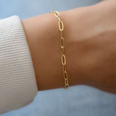 "Dainty paperclip bracelet, perfect for stacking or alone for a minimalist, chic look. - - D E T A I L S - - ▪︎ VERY THICK plating of 14k gold over brass ▪︎ High quality and dainty ▪︎ Measures 6.75\" + .5\" Extension ▪︎ Lobster Claw Closure ▪︎ Nickel-free ▪︎ Each link measures: Bracelets on Model: https://www.etsy.com/listing/911249137/beaded-bracelet-gold-bead-bracelet-gold?ga_search_query=beaded&ref=shop_items_search_3&pro=1 https://www.etsy.com/listing/846628095/evil-eye-red-string-br Simple Diamond Ring, Gold Bracelets Stacked, Paperclip Bracelet, 18k Gold Bracelet, Bracelet Stacking, Red String Bracelet, Gold Armband, Simple Diamonds, Gold Bead Bracelets