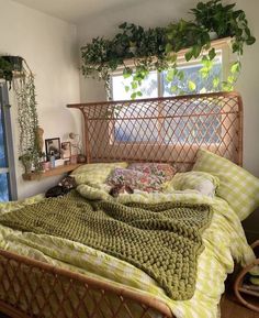 a bed that has some plants on top of it