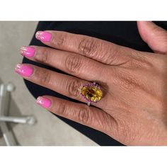 This gorgeous ring has a magnificent Pear Cut Citrine Quartz weighing 5.28 Carats and is surrounded by 25 Pink and Yellow Sapphires that weigh 0.60 carats and 20 Round Cut Diamonds that weigh 0.37 carats. (Clarity: SI, Color: F) The total carat weight of the ring is 6.25 carats. Each stone is handpicked and carefully curated to create a unique piece by our in-house designer and jeweler! The Citrine measures approximately at 11 mm x 16 mm. It is set in 14K White Gold and weighs approximately 3.8 grams. The ring is a size 7  Exact dimensions for this item are unknown. Please reach out in the seller Q&A for any questions on measurements. Exquisite Oval Brilliant Cut Gemstones, Exquisite Oval Brilliant-cut Gemstones, Luxury Multi-stone Yellow Gemstones, Luxury Yellow Multi-stone Gemstones, Luxury Oval Yellow Sapphire Diamond Ring, Luxury Yellow Oval Sapphire Ring, Luxury Yellow Pear-shaped Ring, Yellow Sapphire Oval Diamond Ring, Dazzling Oval Yellow Ring