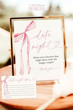 a table topped with a card next to a plate filled with paper and writing on it