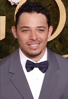 a man wearing a suit and bow tie