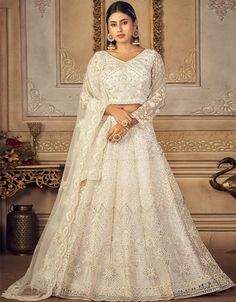 ✨ A Delicate Blend of Net and Silk ✨ Our White Net Lehenga Choli with Banglori Silk celebrates the perfect fusion of grace and luxury. The intricate net fabric exudes an ethereal charm, while the Banglori silk adds a touch of opulence, making this outfit a true masterpiece at any occasion. 🌟 #ArabicAttire #WhiteLehengaCholi #FashionForward #NetAndSilkBlend #StylishLook #ChicStyle #ElegantAppeal #FashionGoals White Indian Lehenga, White Lehenga Choli, White Lehenga, Indian Lehenga Choli, Work Lehenga, Net Blouses, Lehenga Online, Net Lehenga, Lehenga Choli Online