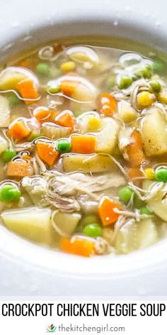 a white bowl filled with chicken vegetable soup