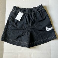 Womens Nike Loose Fit High Rise Shorts Black Nwt Size Small 100% Nylon.. Brand New With Tags Very Comfy Loose Fit Perfect For Everyday Wear. Two Front Pockets Zippered Rear Pocket And A Nice Big Nike Swoosh On The Left Leg. Take A Look At My Other Item And Bundle To Save On Shipping I Am Always Open To Reasonable Offers. Black Nylon Bottoms With Elastic Waistband, Black Nylon Shorts For Spring, Black Nylon Short Bottoms, High Waist Black Nylon Shorts, Black High Waist Nylon Shorts, Nike Casual Nylon Bottoms, Casual Nike Nylon Bottoms, Nike Black Nylon Shorts, Nike Nylon Bottoms With Elastic Waistband