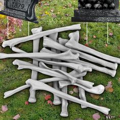 a pile of bones sitting on top of a lush green field next to a mailbox