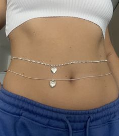 Beautiful handmade belly chain with silver heart pendant detail. Available in 2 different heart designs- Glossy and Textured. Available in 2 different chain styles- Trace and Rhinestone  Approx 83cm Adjustable  Not water resistant Leg Chain, Cute Piercings, Heart Designs, Belly Jewelry, Silver Heart Pendant, Belly Chain, Rhinestone Heart, Outfits Aesthetic, Heart Design