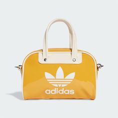 HIGH QUALITY Lorem ipsum dolor sit amet consectetur. FAST SHIPPING Lorem ipsum dolor sit amet consectetur. LOW PRICES Lorem ipsum dolor sit amet consectetur.   New Adidas Original ADICOLOR MINI BOWLING BAG YELLOW / WHITE JJ1651 TAKSE ADICOLOR MINI BOWLING BAG JJ1651 PRELOVED YELLOW / WHITE Features: •Condition : New •Materials: Polyurethane / Polyester •Size: W 8.7"(22cm) x H 5.5"(14cm) x  D 2.7"(7cm) A miniature, glossy bowling bag inspired by heritage styles A retro-inspired staple returns with this mini bowling bag in adidas color. Crafted from glossy faux leather, it's spacious enough to keep your essentials organized. Metal hardware and piping around the edges add a vintage feel. Carry it your way with the adjustable strap over the shoulder or the top handle. Item Specifics Bag Width: Adidas Rectangular Shoulder Bag For Daily Use, Trendy White Adidas Bag, Mini Bowling, Bowling Bag, Adidas Original, Bowling Bags, Bag Green, Swag Shoes, Zipped Bag