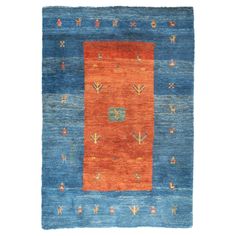 an orange and blue rug with different designs on it