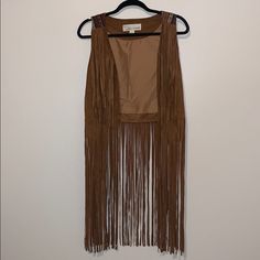 Suede Tassel Vest With Stripped Pattern On The Back Never Worn Bohemian Spring Outerwear With Fringe, Fitted Outerwear With Tassels For Spring, Fitted Spring Outerwear With Tassels, Chic Fringe Outerwear For Festivals, Chic Festival Outerwear With Fringe, Brown Tasseled Outerwear For Spring, Bohemian Brown Outerwear With Tassels, Fitted Casual Outerwear With Tassels, Casual Fitted Tasseled Outerwear