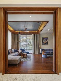 an open living room with wooden floors and walls