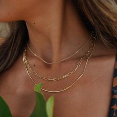 This Paperclip Chain Layered Necklace in 18k gold-filled epitomizes trendy elegance. Its distinct paperclip design offers a modern and stylish layered look, perfect for adding a fashionable edge to any outfit. Chain Necklace Outfit, Chain Layered Necklace, Paper Clip Chain Necklace, Triple Layer Necklace, Herringbone Necklace, 18k Gold Necklace, Layered Necklace Set, Layer Necklace, Gold Choker