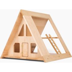 a wooden toy house with stairs and windows