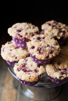 blueberry muffins in a glass dish on a wooden table