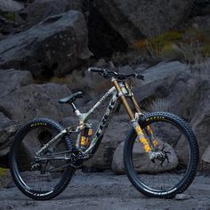 a mountain bike parked in front of some rocks