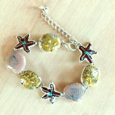 Never Worn Seashell And Starfish Clasp Bracelet Never Worn Bought At Tickles. Shell Bracelet For Beach Season, Vacation Bracelet With Starfish Charm, Summer Bracelet With Starfish Charm, Beach Metal Jewelry With Starfish Charm, Starfish Shaped Shell Jewelry For Beach, Starfish Shell Jewelry For Beach, Silver Bracelet For Beach Season Gift, Gold Starfish Shell For Beach, Handmade Silver Bracelets For Beach Season