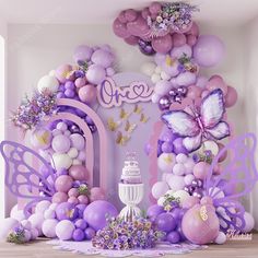 a purple and white birthday party with balloons, streamers, cake and butterflies on the wall