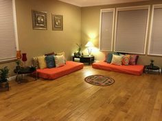 a living room filled with furniture and lots of windows