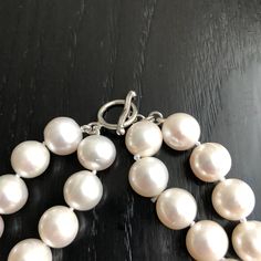 Freshwater Two Strand White Bridal Pearl Necklace. This beautiful necklace is the epitome of class. Two strands hand strung and individually knotted. The shorter strand is 17 inches and the longer strand is 18 inches. Quality pearl necklaces are always knotted between the pearls. This protects the pearls from rubbing together and becoming damaged. All pearls are natural and genuine. PEARL SIZE: 10.5mm - 11.5mm PEARL SHAPE: Round PEARL COLOR: Pearlescent white, a very natural pearl color NECKLACE Elegant Lariat Necklaces Hand Knotted, Elegant Hand-strung Lariat Necklace, Elegant Hand Knotted Lariat Jewelry, Elegant Hand-knotted Lariat Necklaces, Elegant Hand-strung Multi-strand Jewelry, Elegant Hand-strung Jewelry For Anniversary, Elegant Double Strand Necklace With Lobster Clasp, Elegant Hand-strung Double Strand Necklaces, Timeless Round Bead Wedding Necklaces