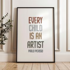 a framed poster with the words every child is an artist and a potted plant