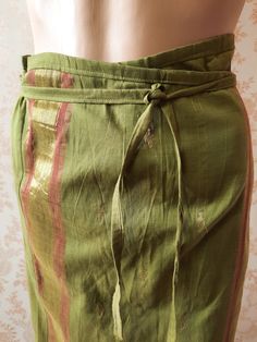 "Olive green wrap skirt 100% cotton with brown and gold stripes and a small gold pattern.  This skirt will fit any size from small to large. Width;   45\" Length;   40\"      Made in India" Green Bohemian Long Wrap Skirt, Bohemian Green Long Wrap Skirt, Festival Cotton Green Skirt, Green Cotton Festival Skirt, Green Bohemian Wrap Skirt, Fitted Green Lined Wrap Skirt, Traditional Fitted Green Skirt, Green Bohemian Cotton Sarong, Traditional Green Summer Skirt