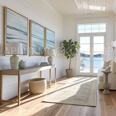 a living room with white walls and wood floors