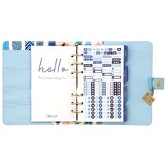 a blue planner book with stickers on the pages and a clipboard attached to it