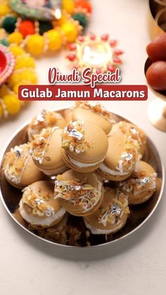 gulab jamun macarons on a plate with other food items in the background