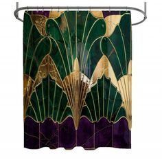 an art deco shower curtain with green and gold fan shaped leaves on it's side